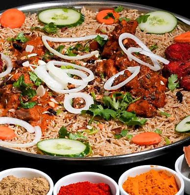 Mixed mandi platter with tandoori chicken, chicken curry pieces, onion, cucumber and carrot on rice